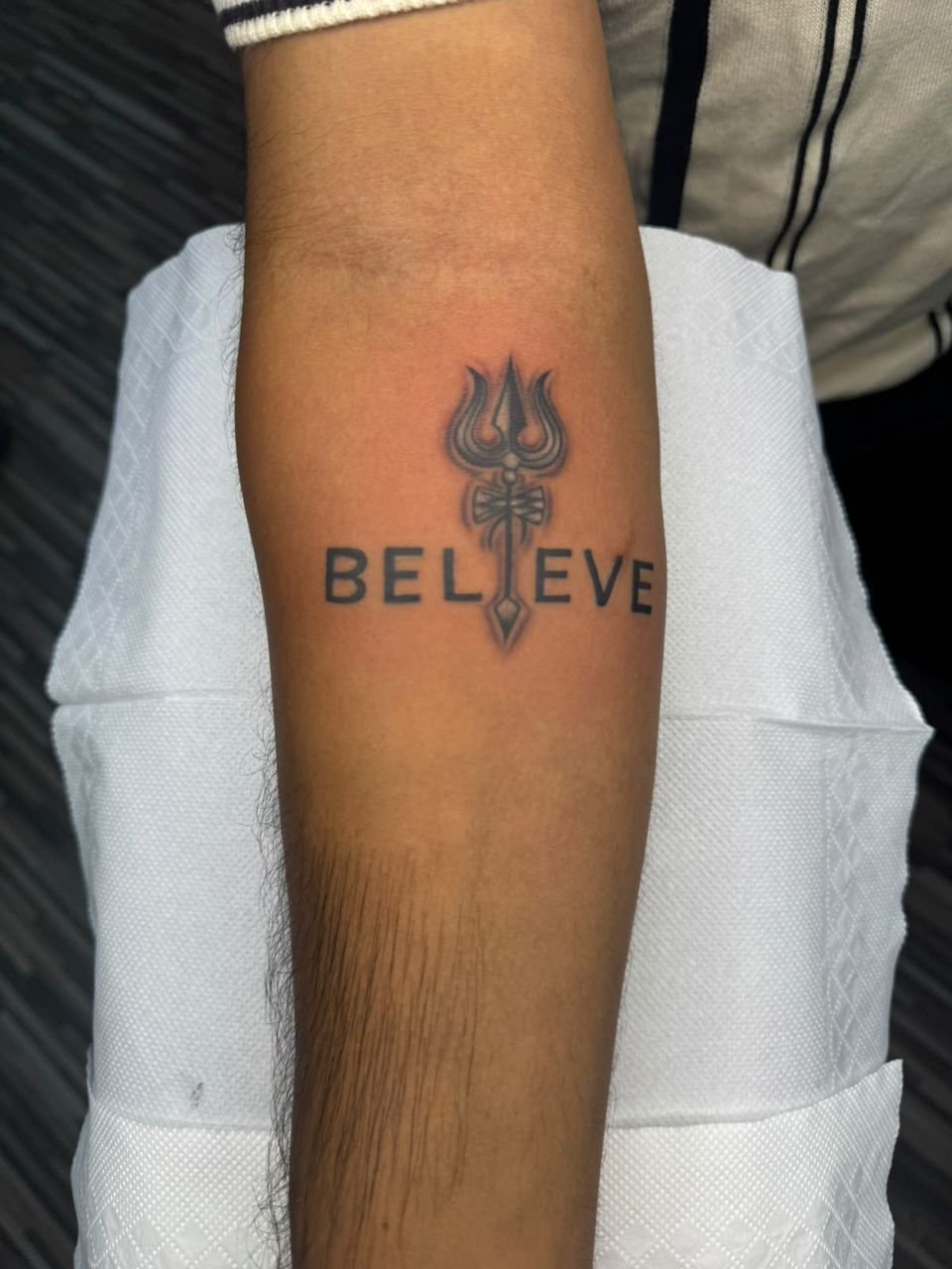 Trident and Believe Tattoo